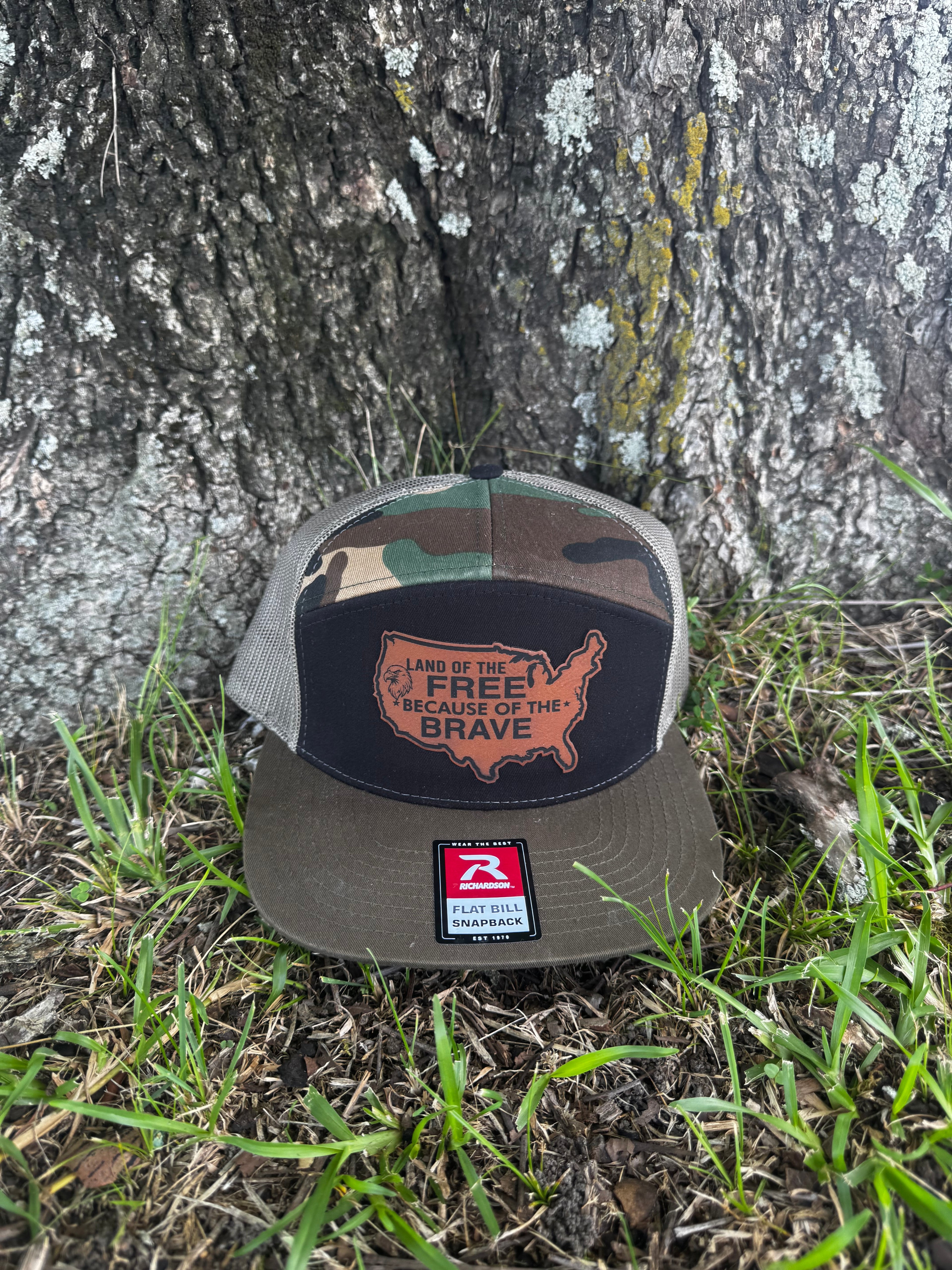 LAND OF THE FREE BECAUSE OF THE BRAVE LEATHER PATCH RICHARDSON 168 FLAT BILL CAMO TRUCKER HAT