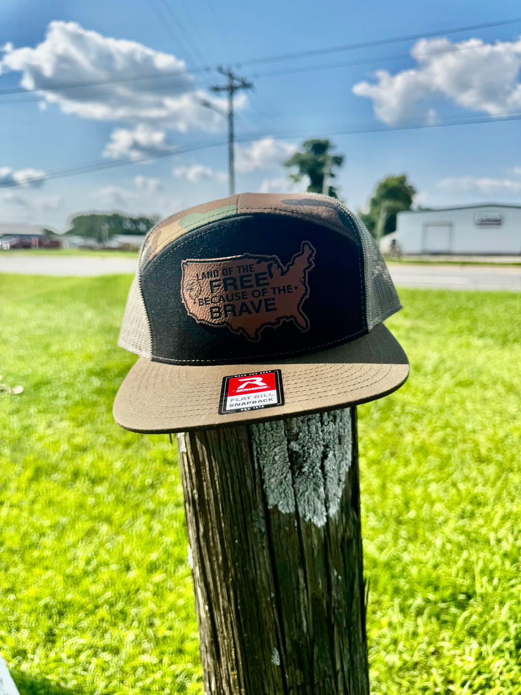 LAND OF THE FREE BECAUSE OF THE BRAVE LEATHER PATCH RICHARDSON 168 FLAT BILL CAMO TRUCKER HAT