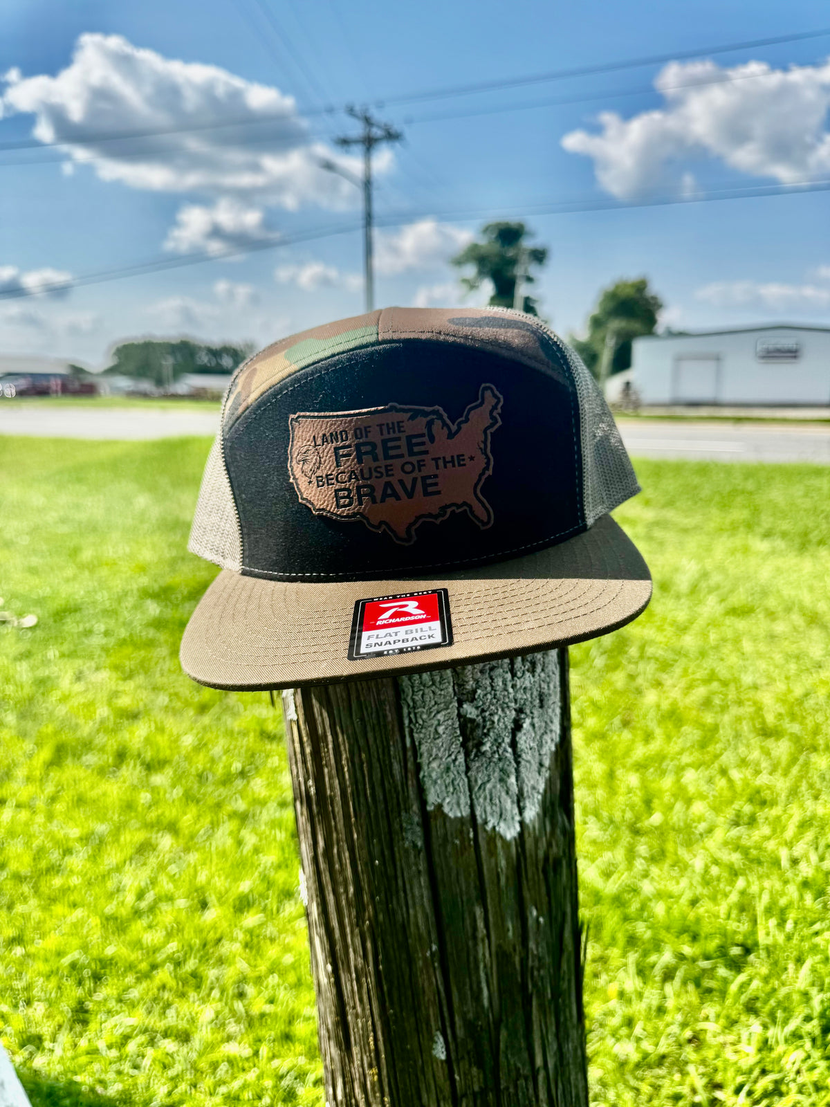 LAND OF THE FREE BECAUSE OF THE BRAVE LEATHER PATCH RICHARDSON 168 FLAT BILL CAMO TRUCKER HAT